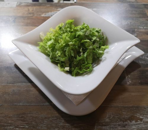 Green salad served as a side dish.