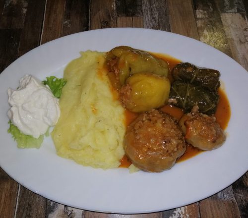 Japrak, Dolma and Sogan Dolma served with mashed potatoes and soured cream on the side.